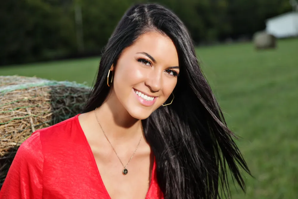 Portrait of Isabelle Tate smiling confidently, representing passion and purpose